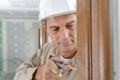 professional locksmith installing or repairing lock Royalty Free Stock Photo