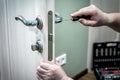 Locksmith repair or install the door lock in house Royalty Free Stock Photo