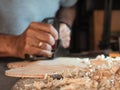 Professional luthier violinmaker artisan working on making a handmade violin with ancient tradtitional Stradivarius craftmanship