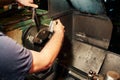 Professional machinist : man operating lathe grinding machine Royalty Free Stock Photo