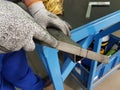 Professional maintenance worker holding iron filing in his hand, closeup equipment