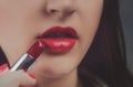 Professional Make-up. Applying red liptick Royalty Free Stock Photo