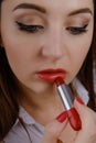 Professional Make-up. Applying red liptick Royalty Free Stock Photo