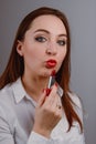 Professional Make-up. Applying red liptick Royalty Free Stock Photo