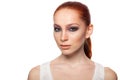 Professional Make-up artist doing glamour with red hair model makeup. Isolated background. Royalty Free Stock Photo