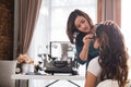 Professional make up artist preparing model Royalty Free Stock Photo