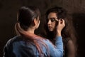 Professional make up artist preparing brunette womanl before photo session Royalty Free Stock Photo