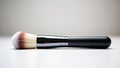 Professional makeup brush with a sleek black handle and soft bristles Royalty Free Stock Photo