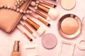 Professional makeup brushes, Golden bronzer and blush, Foundation and various cosmetics Royalty Free Stock Photo