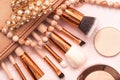 Professional makeup brushes, Golden blush, Foundation and various cosmetics Royalty Free Stock Photo