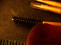 Makeup brushes, everyday make-up tools. Cosmetic essentials on bright dark background, closeup Royalty Free Stock Photo