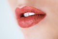 Professional makeup. Lipgloss. Close up portrait of beautiful girl with colorful red lips and lipstick. Caucasian young woman mode Royalty Free Stock Photo