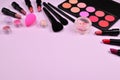 Professional makeup products with cosmetic beauty products, blushes, eye liner, eye lashes, brushes and tools