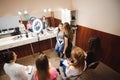 Professional makeup teacher training her student girl to become makeup artist. Makeup tutorial lesson at beauty school