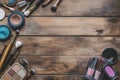 Professional makeup tools. Makeup products on wooden background. Royalty Free Stock Photo