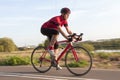 Professional Male Cyclist in Racing Outfit During a Ride on Bike Outdoors