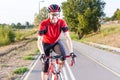 Professional Male Cyclist Riding Road Bike. Equipped with Summer Outfit Royalty Free Stock Photo