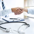 Professional Male doctor in white coat shaking hand with female patient after successful recommend treatment methods, Medicine and Royalty Free Stock Photo