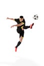 Professional male football soccer player in motion and action isolated on white studio background. Concept of sport Royalty Free Stock Photo