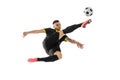 Professional male football soccer player in motion and action isolated on white studio background. Concept of sport Royalty Free Stock Photo