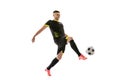 Professional male football soccer player in motion and action isolated on white studio background. Concept of sport Royalty Free Stock Photo