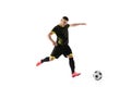 Professional male football soccer player in motion and action isolated on white studio background. Concept of sport Royalty Free Stock Photo