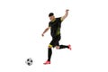 Professional male football soccer player in motion and action isolated on white studio background. Concept of sport Royalty Free Stock Photo