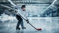 Professional male hockey player on ice court background. Caucasian fit athlete practicing, training excited Royalty Free Stock Photo