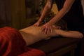Professional male masseur doing massage for female client at spa salon Royalty Free Stock Photo