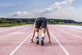 Professional male runner taking ready to start position Royalty Free Stock Photo