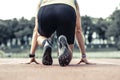 Professional male runner taking ready to start position Royalty Free Stock Photo