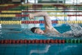 Professional male swimmer swimming the front crawl style Royalty Free Stock Photo