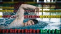 Professional male swimmer swimming the front crawl style Royalty Free Stock Photo