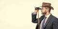 Professional man in cowboy hat look through binoculars isolated on white copy space, business vision