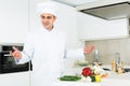 Professional man chef searching ingredients, preparing vegetables