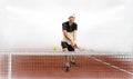 Professional man holding tennis racket and ball while training Royalty Free Stock Photo