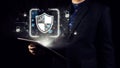 Digital security concept with shield symbol and glowing data connections in a professional business setting with a man Royalty Free Stock Photo
