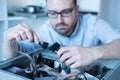 Professional man repairing and assembling a computer Royalty Free Stock Photo