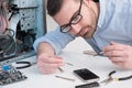 Professional man repairing phone screen Royalty Free Stock Photo