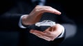 Businessman presenting a holographic car model with hands in a professional setting showcasing innovation Royalty Free Stock Photo