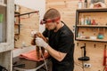 Professional Man veterinarian dentist doing procedure of professional teeth cleaning dog in a veterinary clinic. Pet healthcare