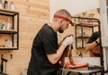 Professional Man veterinarian dentist doing procedure of professional teeth cleaning dog in a veterinary clinic. Pet healthcare