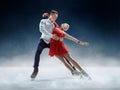 Professional man and woman figure skaters performing on ice show Royalty Free Stock Photo