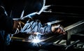 Professional mask protected welder man working on metal welding. Selective Focus Royalty Free Stock Photo