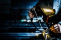 Professional mask protected welder man working on metal welding and sparks metal Royalty Free Stock Photo