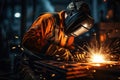 Professional mask protected welder man working on metal welding and sparks metal Royalty Free Stock Photo