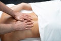 Professional masseur doing therapeutic massage on lady back Royalty Free Stock Photo