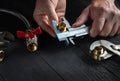 Professional master plumber measures the size of fitting using a caliper before connecting water or gas pipe. Close-up of the