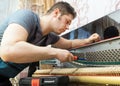 Professional master tuning the piano