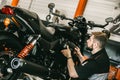 Professional mechanic change the air filter in the motorcycle. Royalty Free Stock Photo